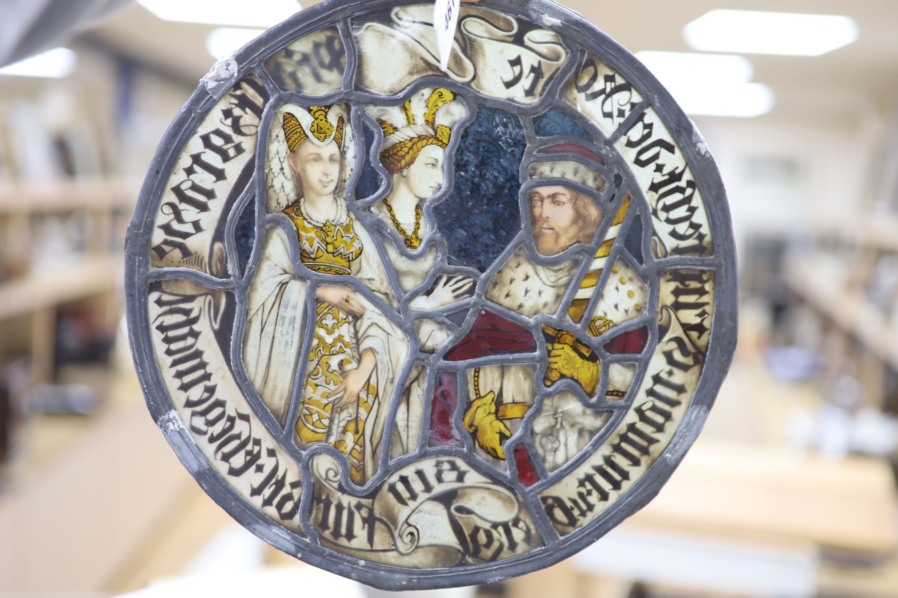 A 19th century German oval leaded and stained glass panel, in the 16th century style, 30cm